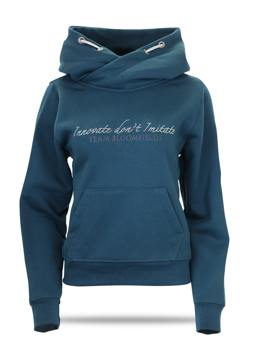 Petrol blue crossover cowl neck hoodie with rhinestone Innovate Don't Imitate script, glitter Bloomfields B sleeve logo and Union Jack patch by Team Bloomfields
