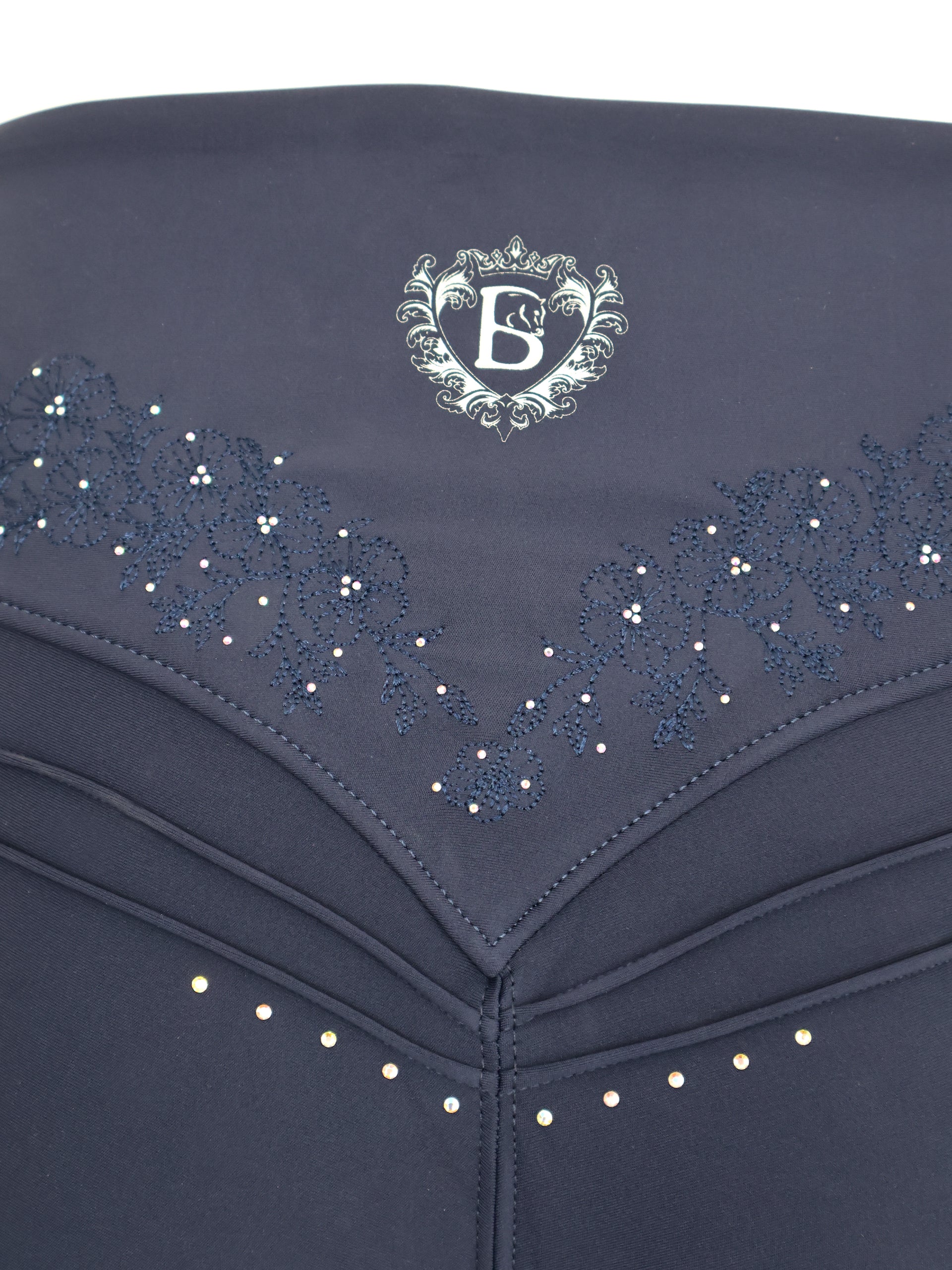Close-up detail of back waistband embroidery on the Navy Anemone Leggings