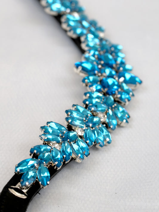 Aqua crystal V shape browband on black leather by Team Bloomfields, showing marquise cut rhinestone detail with clear accent stones, available in pony cob and full size
