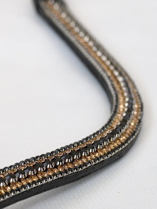 Black and gold crystal curved browband on black leather by Team Bloomfields, showing triple row black, gold and silver rhinestone detail, available in pony cob and full size