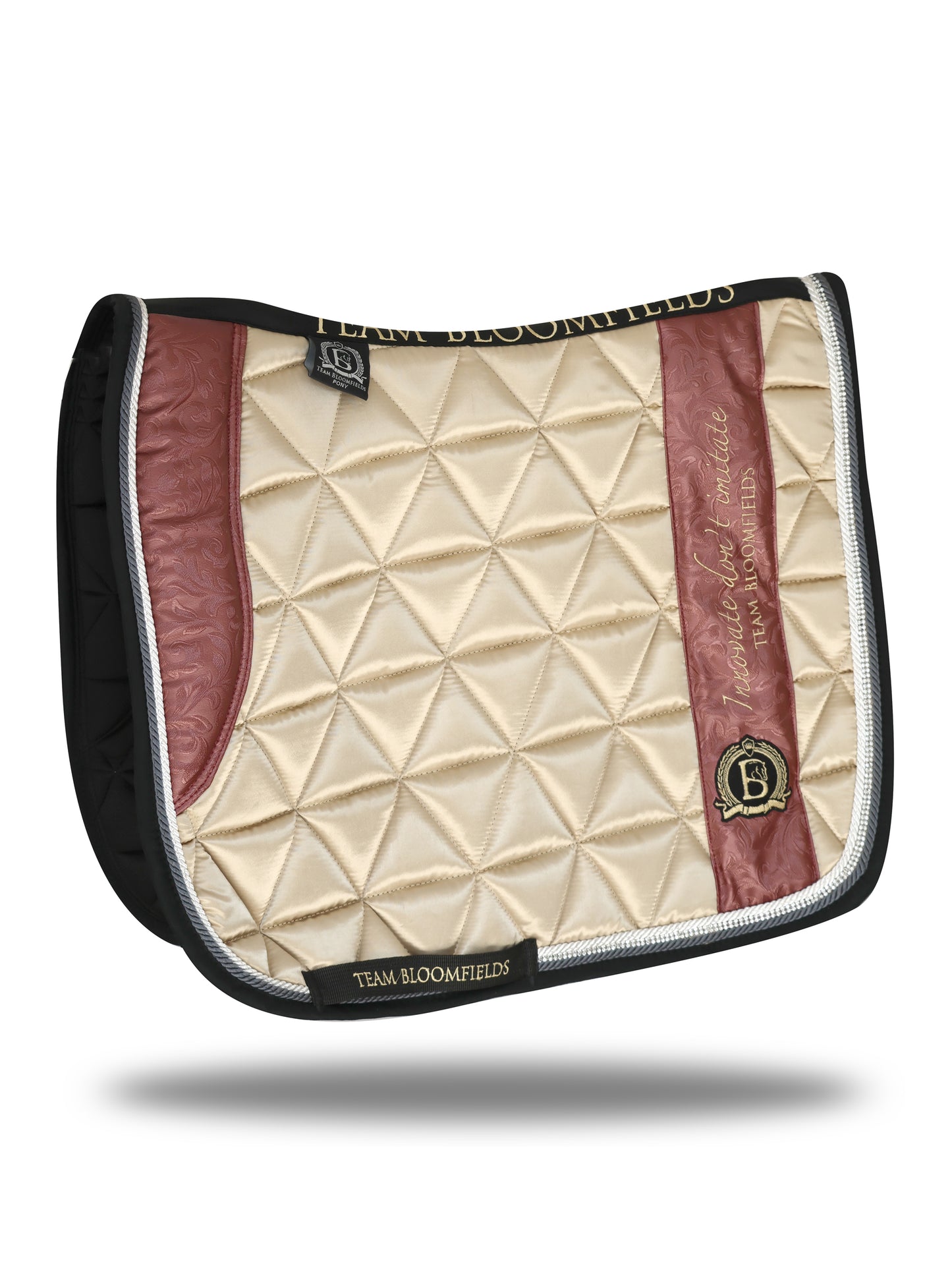 Cream and winter berry paisley dressage saddle pad with intricate paisley print and Bloomfields branding by Team Bloomfields, available in pony cob and full