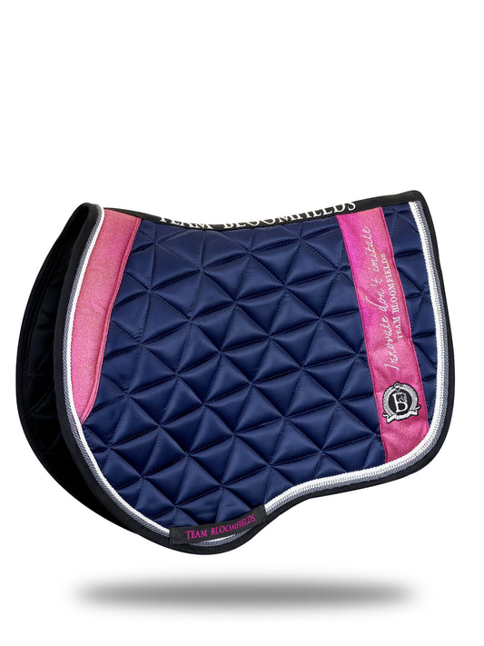 Shop the Team Bloomfields Navy & Hot Pink Glitter Jump Saddle Pad. Classic navy with vibrant hot pink glitter detailing. Pony, cob and full sizes.