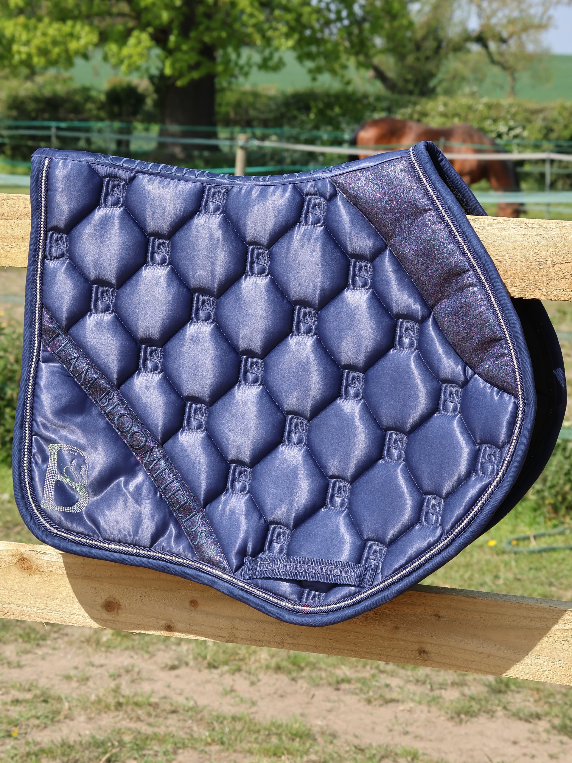 Navy sparkle jump saddle pad with tonal navy glitter panel and diamanté Bloomfields B by Team Bloomfields, available in pony cob and full